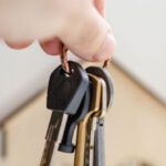 Cashback Offers - Person with keys for real estate