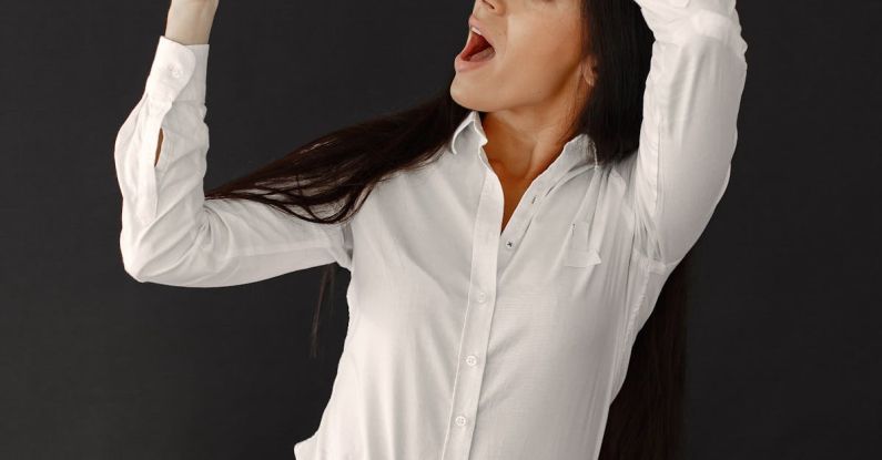 Seasonal Sales - Woman with Sale Banner on Black Background