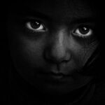 Hidden Costs - Grayscale Photography of Girl's Face