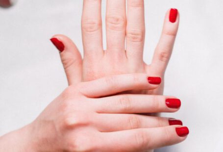 Beauty Tools - Person With Red Nail Polish
