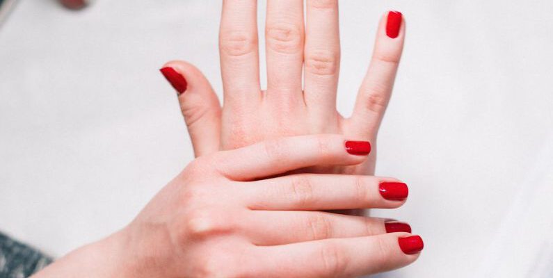 Beauty Tools - Person With Red Nail Polish